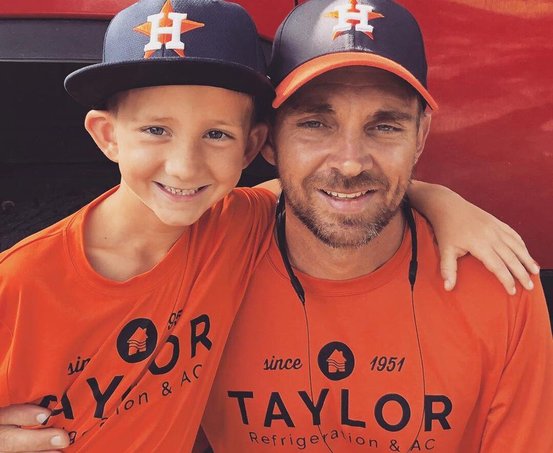 ben and child at a baseball game